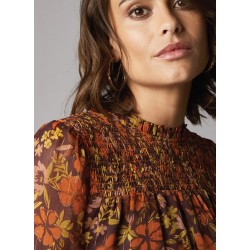 Blouse imprimée, col montant et plastron smocké