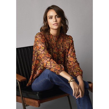 Blouse imprimée, col montant et plastron smocké